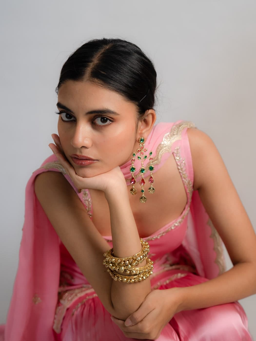 Geet set in pink, close portrait showing the zardosi pitta palm-tree embroidery