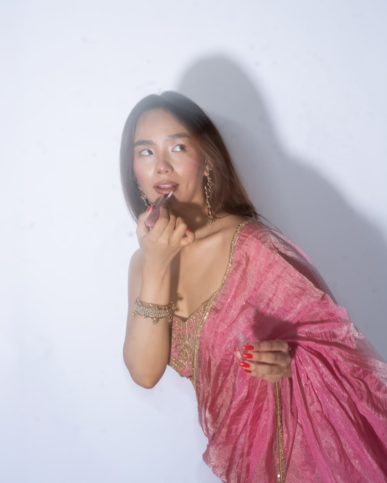 Reyna saree in pink, portrait showing the zardosi bustier blouse and tassels