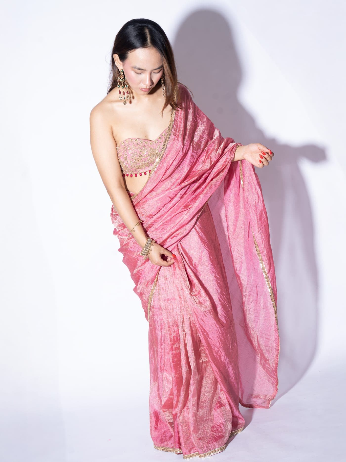 Reyna silk tissue saree in pink, full drape, the pallu held out